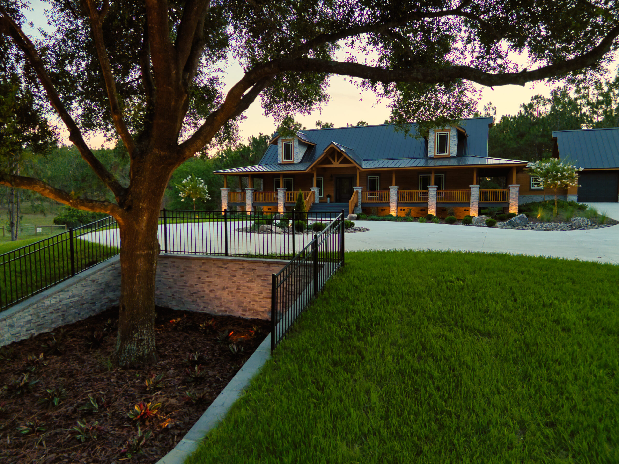 Luxury custom home exterior with detailed driveway