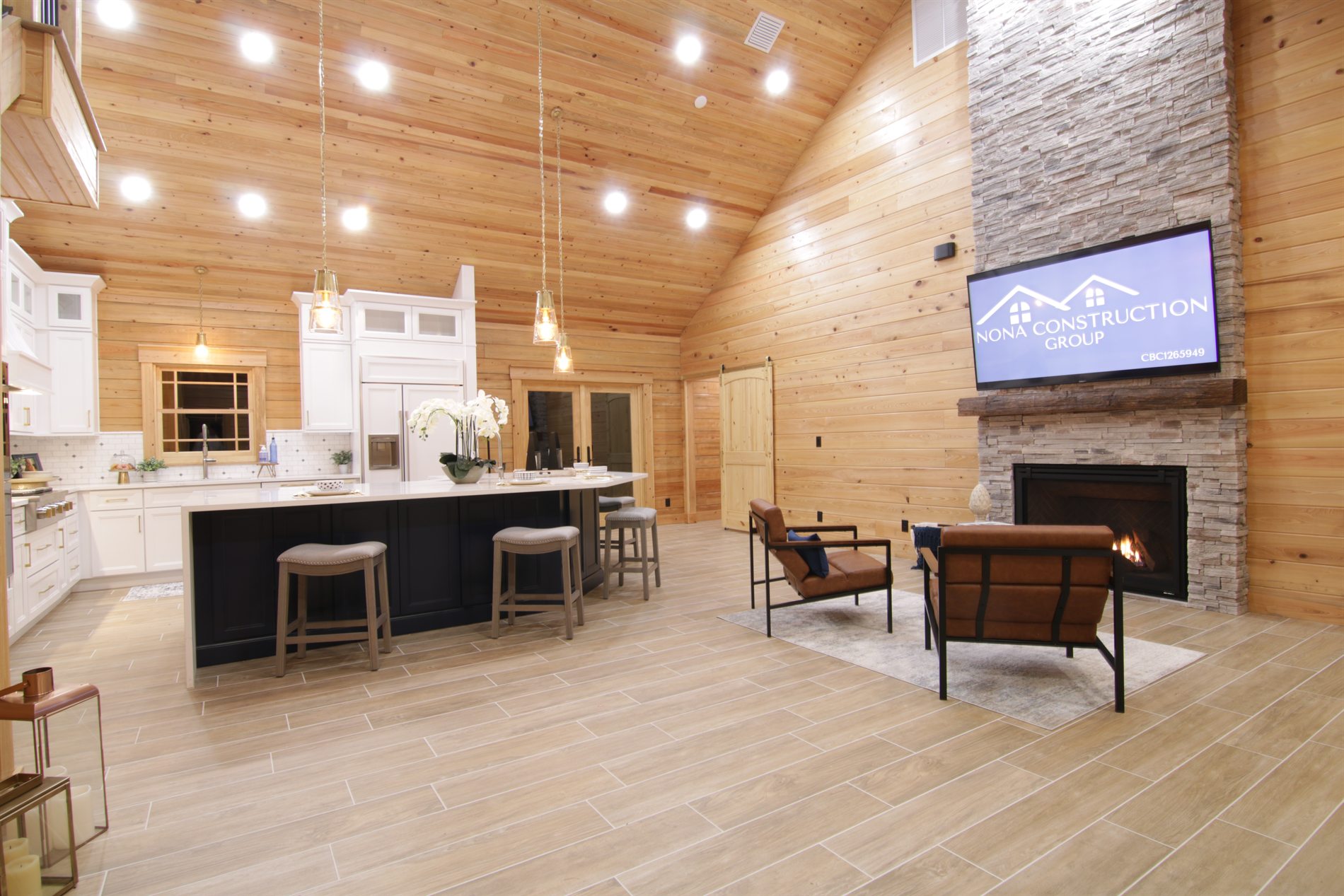 Vaulted wood ceiling kitchen and living room inside an Apopka custom log cabin