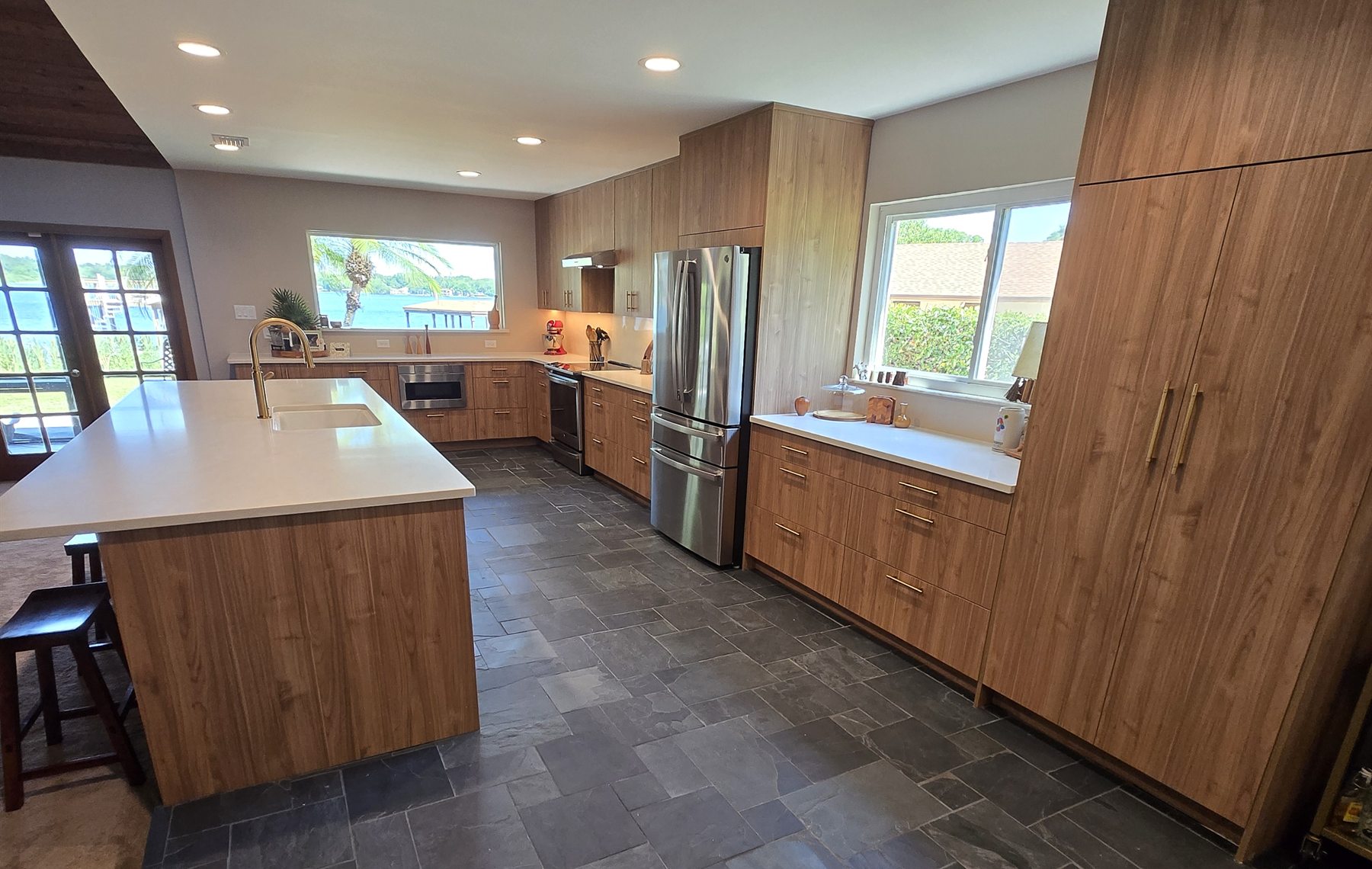 Wood cabinetry and slate tile flooring in a Downtown Orlando kitchen renovation
