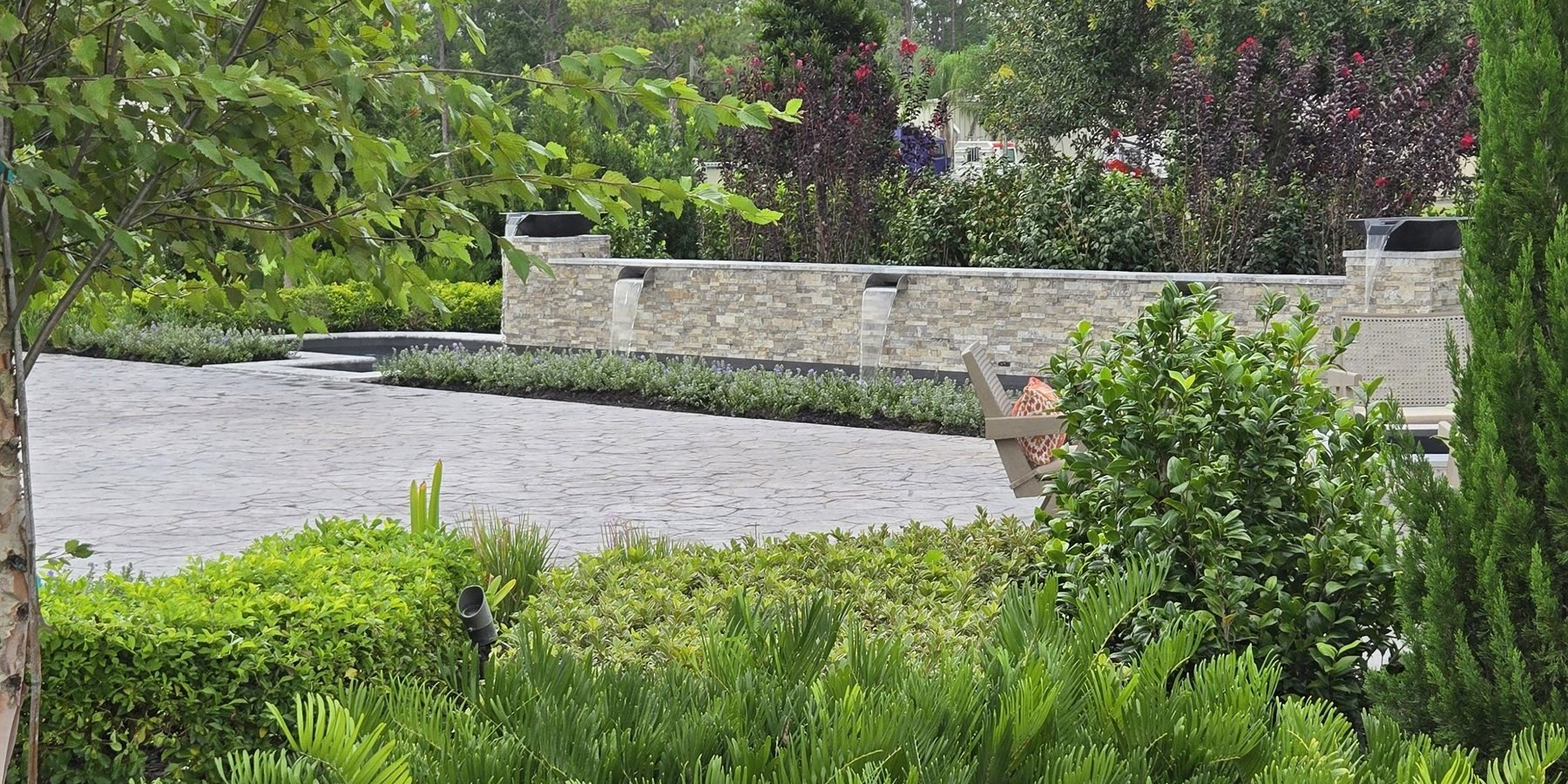 Central Florida pool and outdoor living project with water feature and hardscape detailing